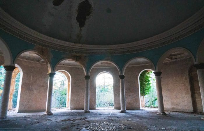 abandoned Soviet-era sanatorium in Tskaltubo, Georgia, showcasing elegant architectural elements and the haunting beauty of forgotten spaces