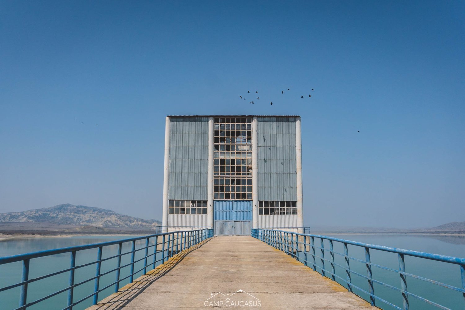 View from walkway leading to Soviet-era control tower over Dali mountaini reservoir in Vashlovani National Park, Georgia, Europe