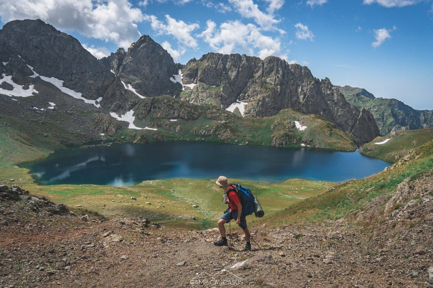 Solo hiker standing near Silver Lake on Tobavarchkhili wild trail
