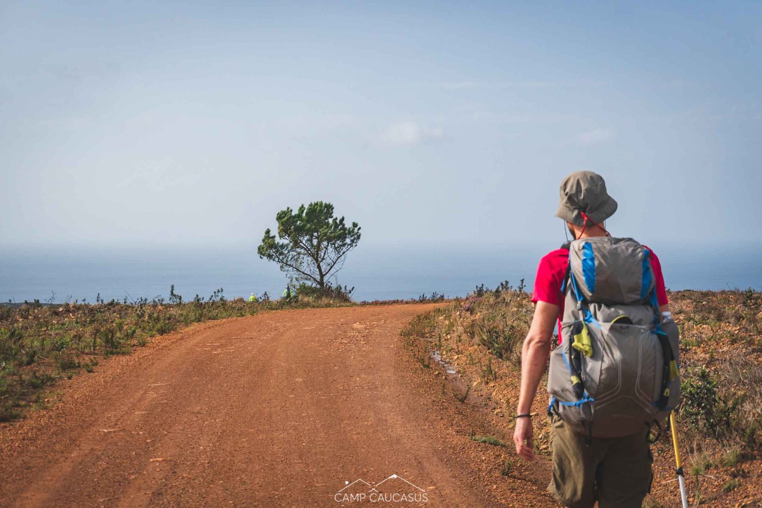 Hiker walking along the Fisherman’s Trail near Carrapateira, Algarve, Portugal.